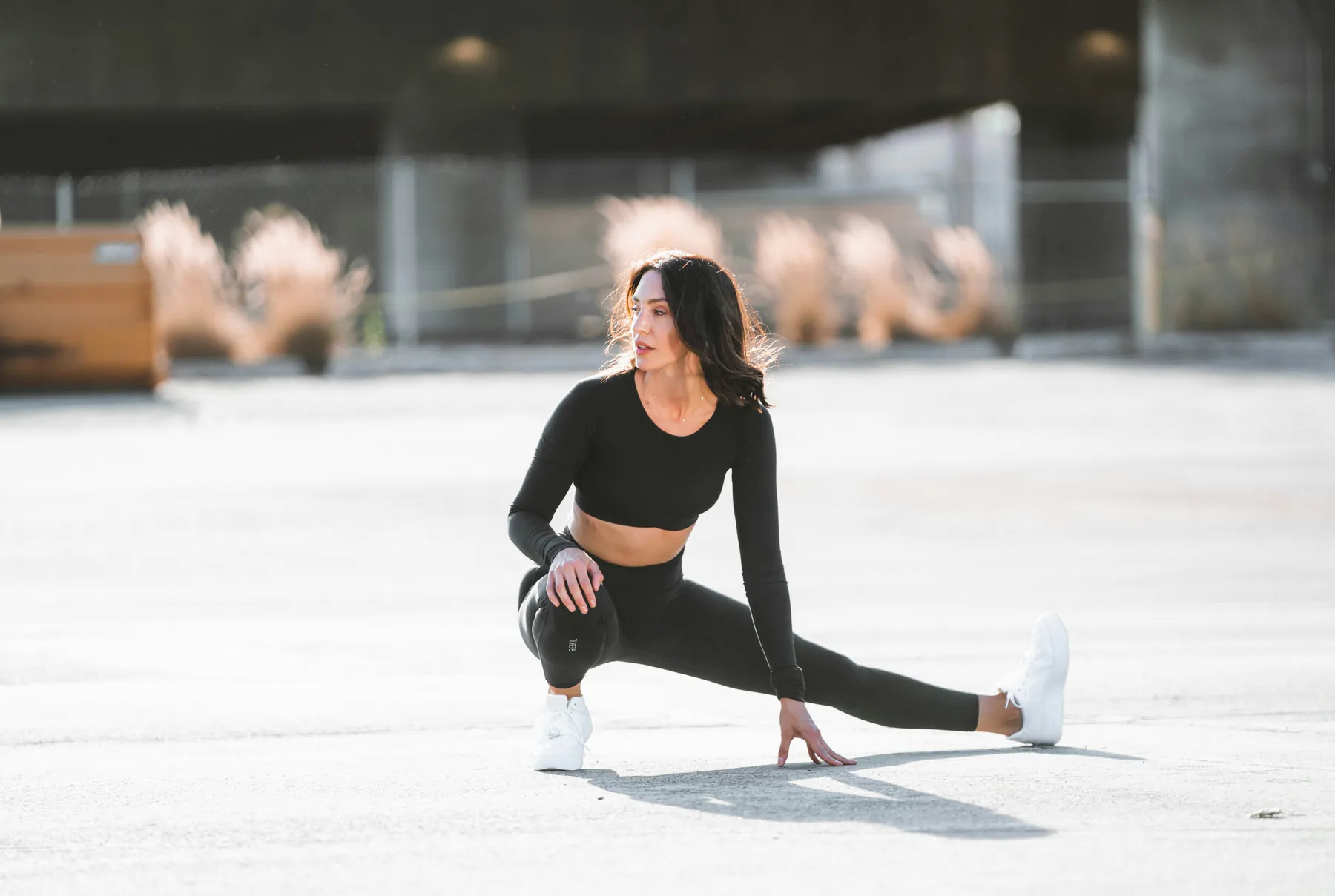 Woman stretching outdoors before a run